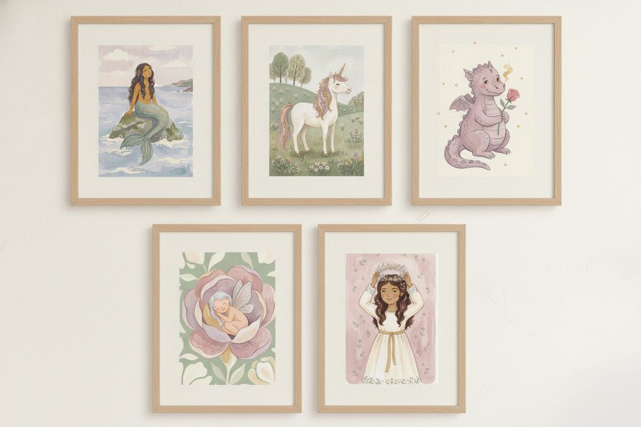 The five free princess prints framed in a loose grid on a cream wall